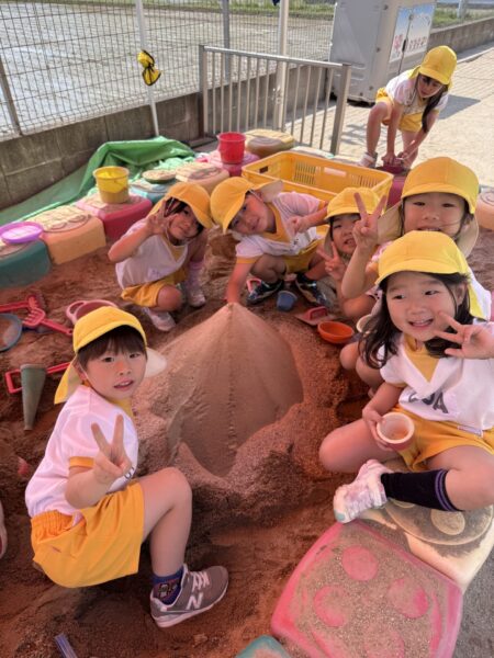 Look! We made a big sand mountain!